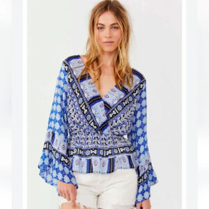 FREE PEOPLE Rosalie Wrap Top IN Indigo. Size medium